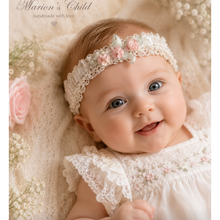 Load image into Gallery viewer, a baby wearing a white lace dress and a pink floral headband, with the text 'Marian's Child' on the image.