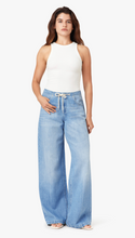 Load image into Gallery viewer, Woman wearing light blue wide-leg jeans with a white drawstring and a white sleeveless top on a white background
