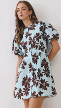 Load image into Gallery viewer, Woman wearing a lite blue and brown floral dress

