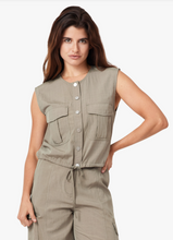 Load image into Gallery viewer, Woman wearing a beige button down sleeveless vest 
